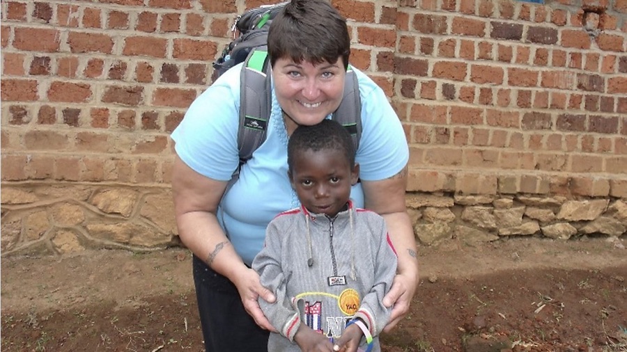 Lynne Brouillette with a student at a school in the Congo.